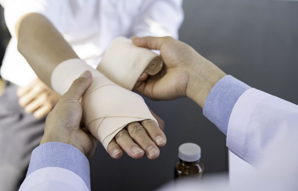 A doctor wrapping a patient's wrist