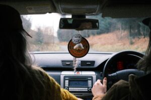 how old do you have to be to sit in the front seat