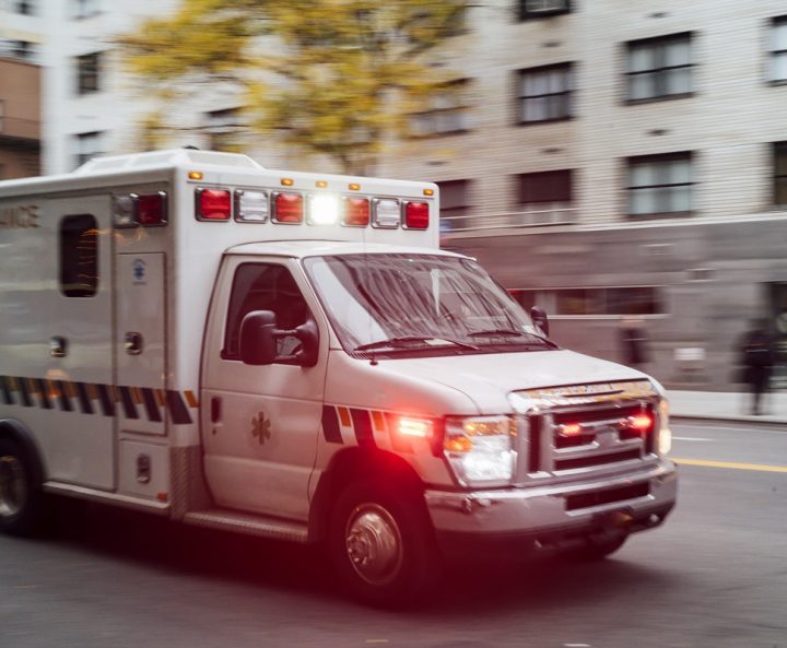 An ambulance driving on a city street